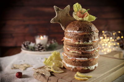 Italian christmas appetizer. stuffed gourmet panettone with salmon and cheese, rustic background.  