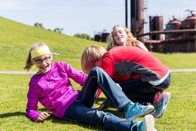 Kids playing on grass at park