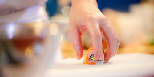 Close-up of hand holding ice cream