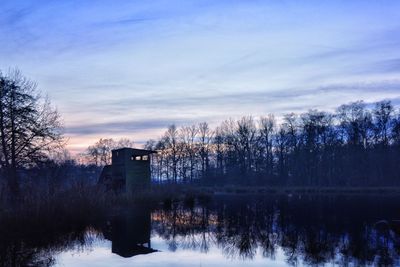 Scenic view of lake against sky during sunset