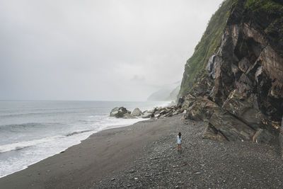 View of calm beach against the sky