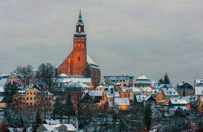 Buildings in city against sky at ore mountain 