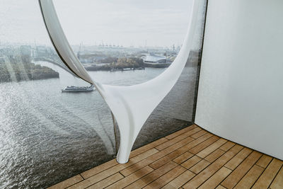 River seen through glass window of modern building