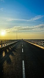 Empty road at sunset