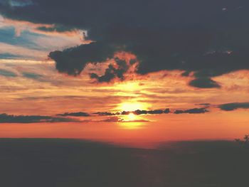 Scenic view of dramatic sky during sunset