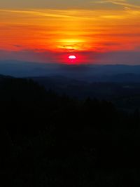 Scenic view of silhouette landscape against romantic sky at sunset
