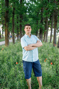 Portrait of a man standing on field