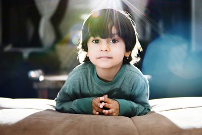 Portrait of boy lying on sofa