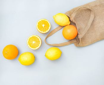 High angle view of orange fruits on white background