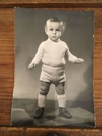 Portrait of cute boy standing at home