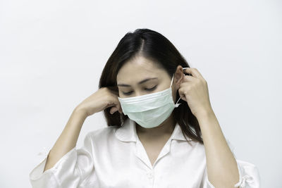 Portrait of a beautiful young woman over white background