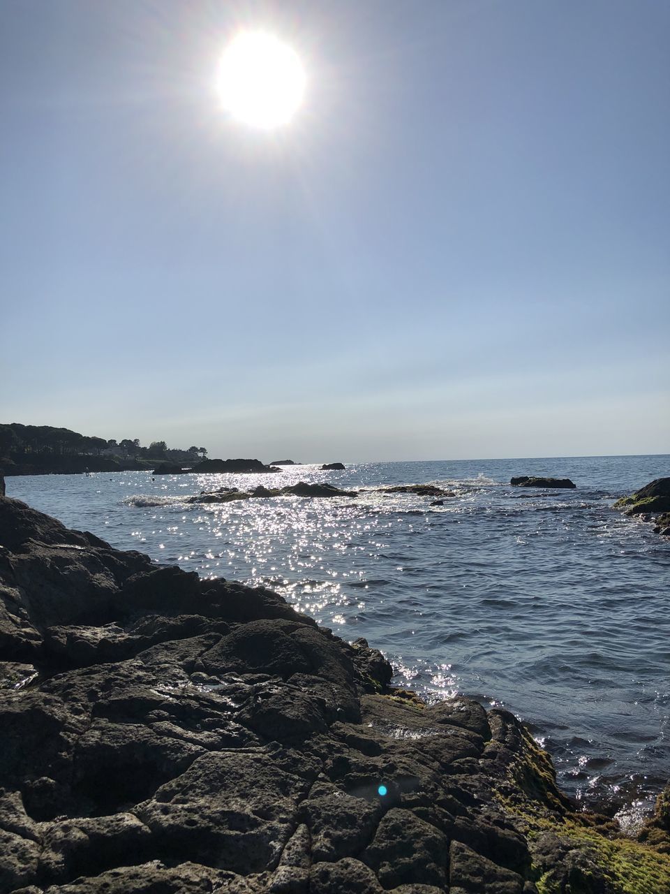 SCENIC VIEW OF SEA AGAINST BRIGHT SKY