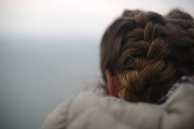 Rear view of woman with braided hair