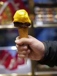 Hand holding ice cream cone