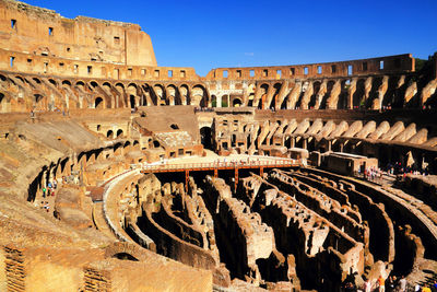 High angle view of coliseum against clear blue sky