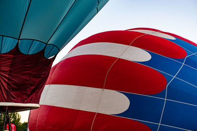 Low angle view of hot air balloon against blue sky