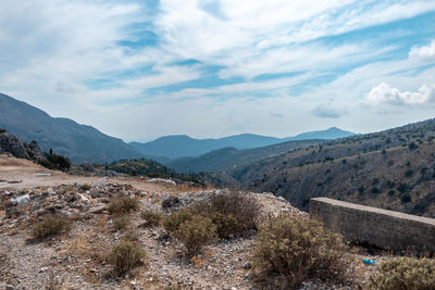 Scenic view of landscape and mountains against sky