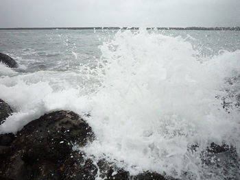 Waves splashing on rocks