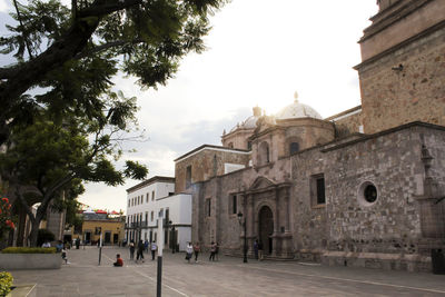 Buildings in city against sky