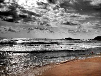 Scenic view of sea against cloudy sky