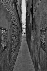 Walkway amidst buildings