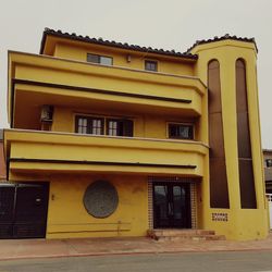 Yellow building against sky