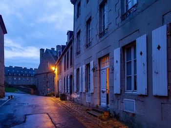 Illuminated city against sky