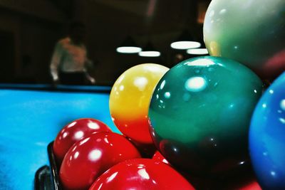 Close-up of multi colored balls on table