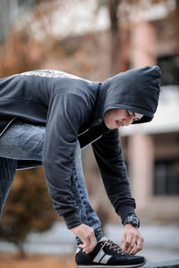 Full length of young man against blurred background