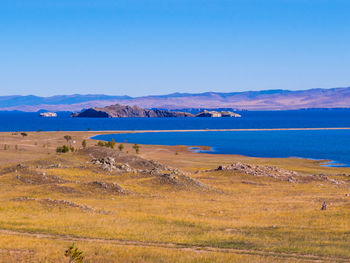 Scenic view of sea against clear blue sky