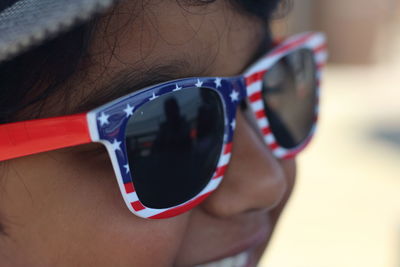 Close-up portrait of a boy wearing sunglasses