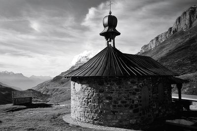 Clothes hanging on mountain against sky