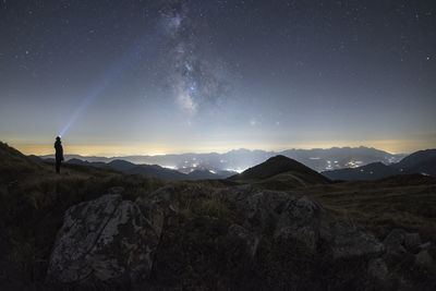 Low angle view of mountain against sky at night