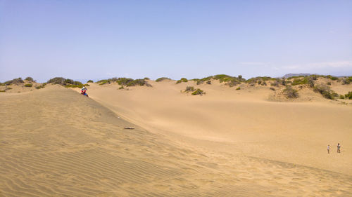 Scenic view of desert against clear sky