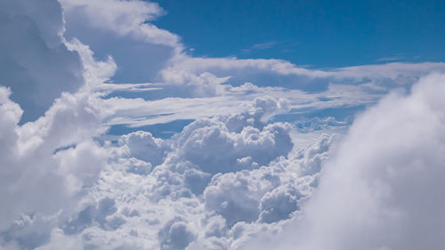 The cloudscape of beautiful cloud in the sky background view from airplane.