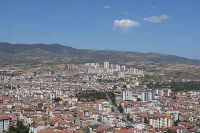 Aerial view of townscape against sky