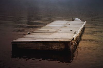 Wooden jetty on pier at lake