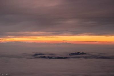 Scenic view of landscape against cloudy sky