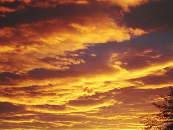 Low angle view of dramatic sky during sunset