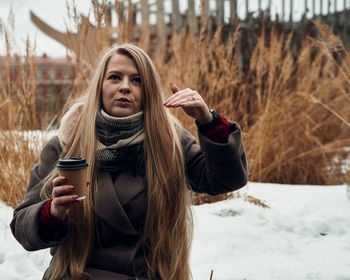 Portrait of young woman in snow