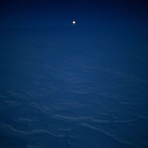 Aerial view of sea against moon at night