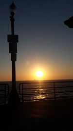 Scenic view of sea against orange sky