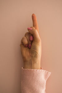 Close-up of human hand on wall