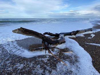 Scenic view of sea against sky during winter