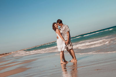 Young couple embracing at beach