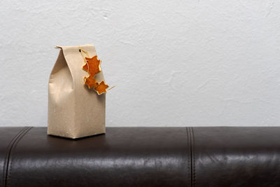 Close-up of stuffed toy on table against wall