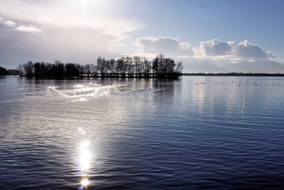 Scenic view of lake against sky during sunset