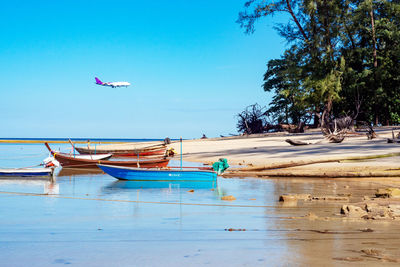 Scenic view of sea against blue sky