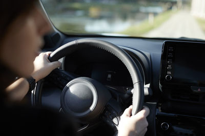 Businesswoman driving electric car