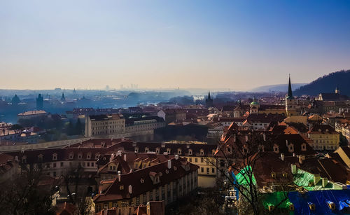 High angle view of buildings in city against clear sky